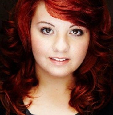 Headshot of pretty girl with red hair