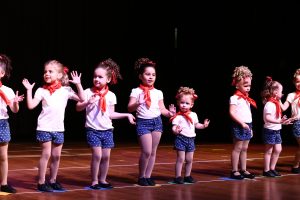 Young pre-school aged girls dressed as sailors dance
